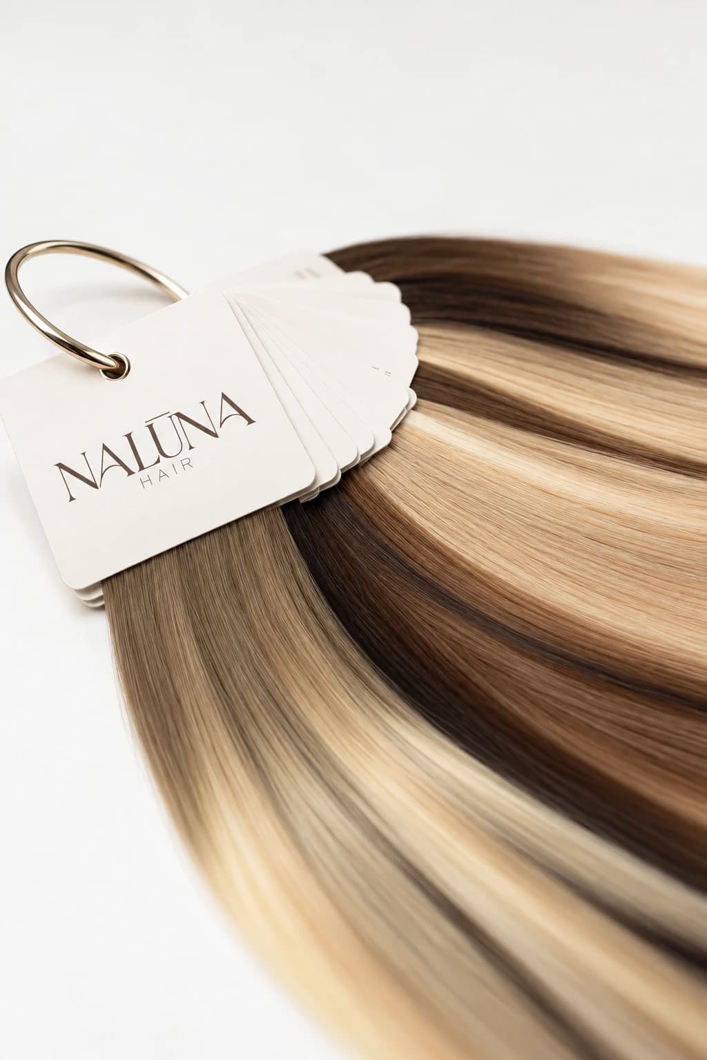 Naluna Hair shade ring with swatches from deep brown to light blonde